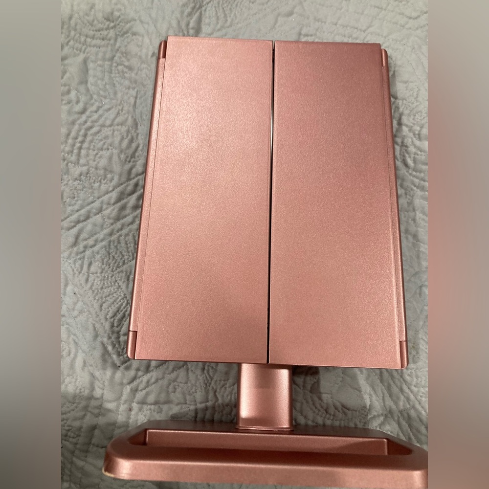 Rose gold, foldable light up mirror, batteries included, could run of a usb cord